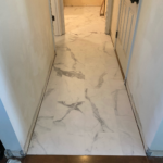 Luxury Vinyl Tile in hallway. Baseboards added later.